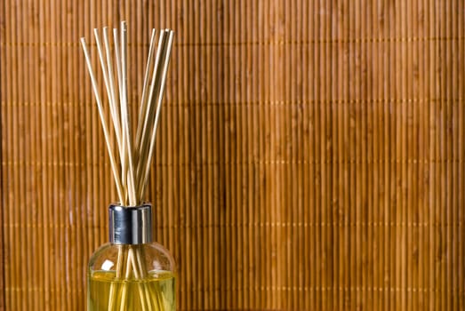 aroma sticks dipped in scented oils on bamboo background