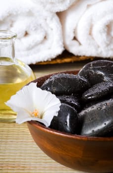bowl of hot stones for lastone massage