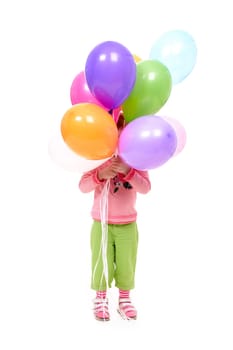 Image of small girl holding colorful balloons before herself on white background