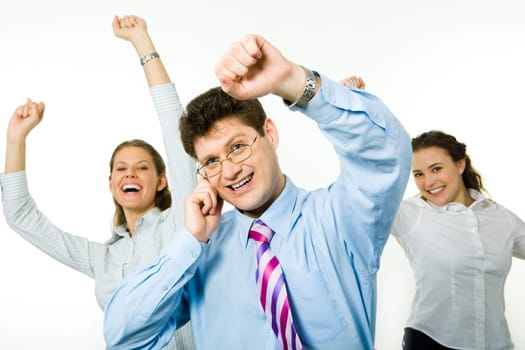 Portrait of happy business people raising hands
