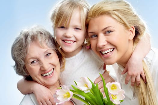Portrait of happy girl hugging mature lady and woman