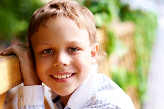 Portrait of happy kid looking at camera