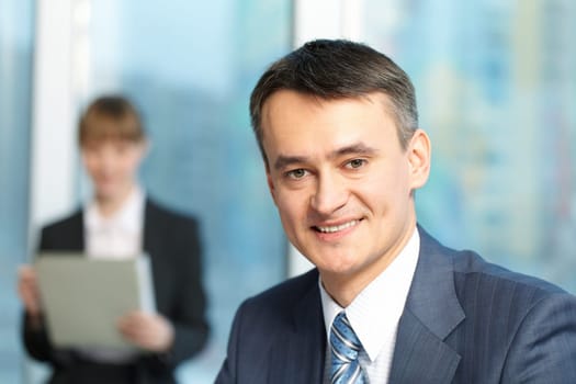 Close-up of mature smiling managers face