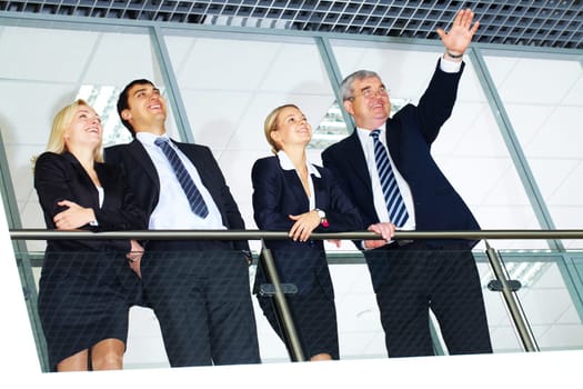 Group of businesspeople with senior boss looking forward