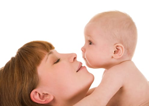 Close-up of careful mummy with her baby on white background