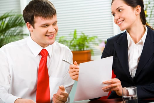 Image of pretty business woman giving the pen and paper to man