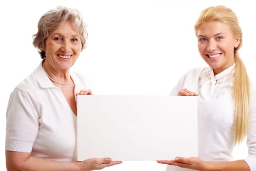 Portrait of mature lady and young woman holding paper
