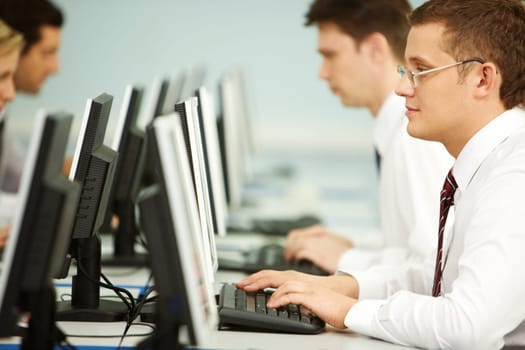 Clever businessmen typing in line at workplace