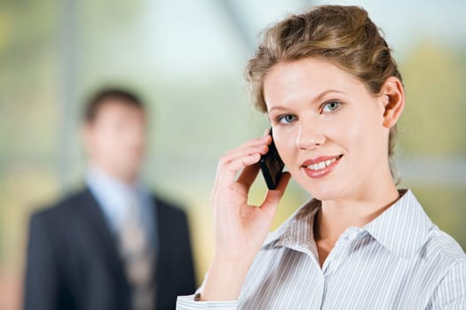 Portrait of beautiful business woman calling on mobile