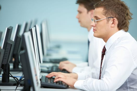 Close-up of a businessman working on computer