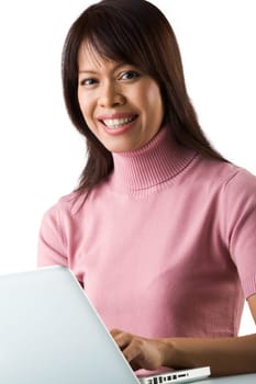 Image of young successful employer typing on laptop and smiling at camera