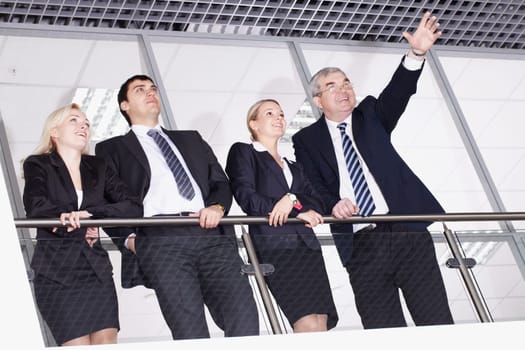 Group of businesspeople with their senior boss