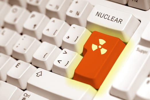 radioactive button on a keyboard computer in orange