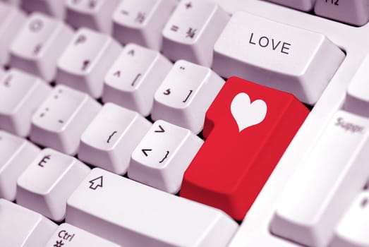 heart symbol on a red key of a keyboard