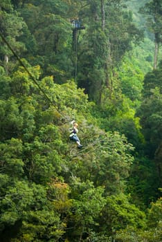 woman on a zip line in panama canopy