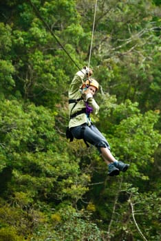 woman on a zip line in panama canopy