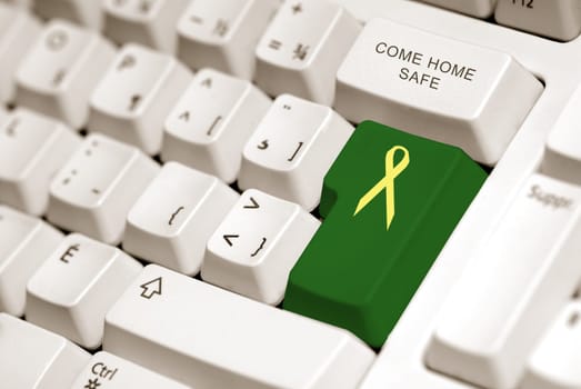 yellow ribbon on green button to sybolized troop support