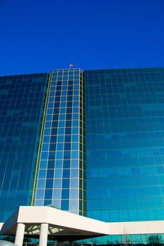 office building of glass on a blue sky