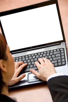 woman at the office working on her laptop