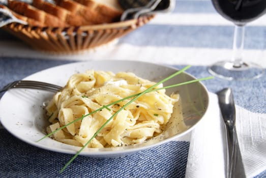 linguini meal with wine
