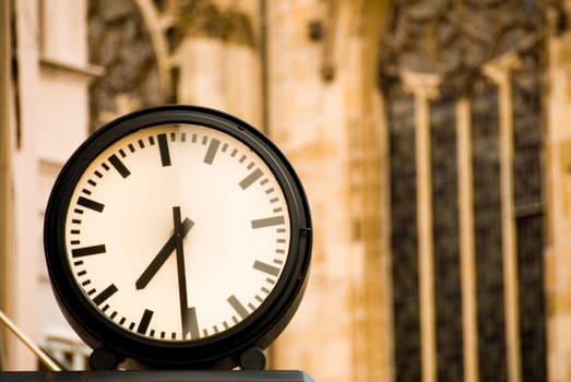 An outside clock showing the time warm