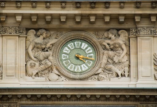 this is an antique clock in a building face