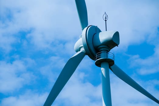 clean energy white wind turbine in the sky