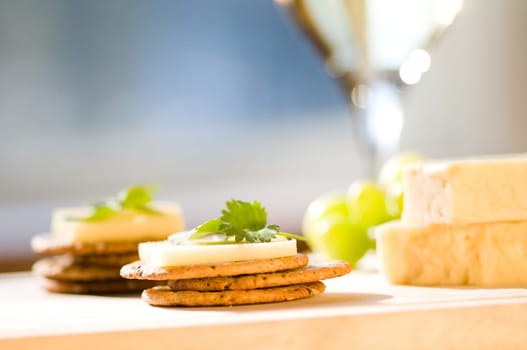 cheese and crackers on a cutting board