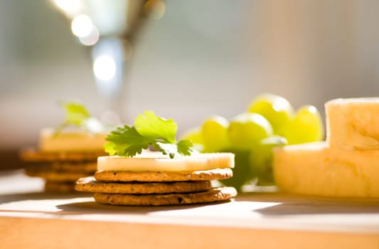 cheese and crackers on a cutting board