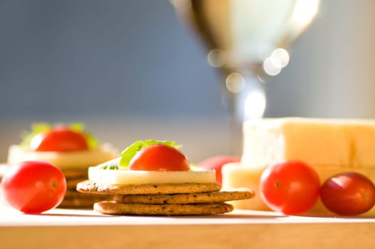 cheese and crackers on a cutting board