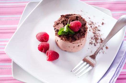 Chocolate Moose dessert on a white plate with milk
