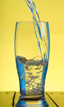 pouring water in a glass
