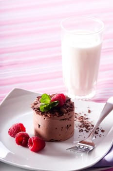 Chocolate Moose dessert on a white plate with milk