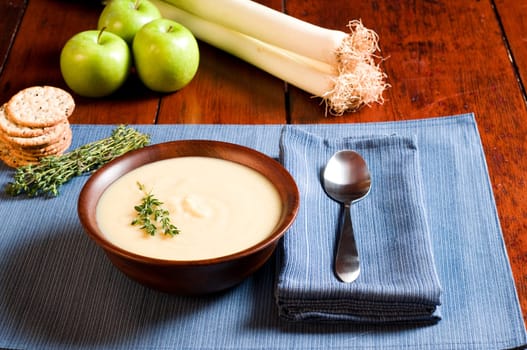 Apple and Leek Soup on a rustic table
