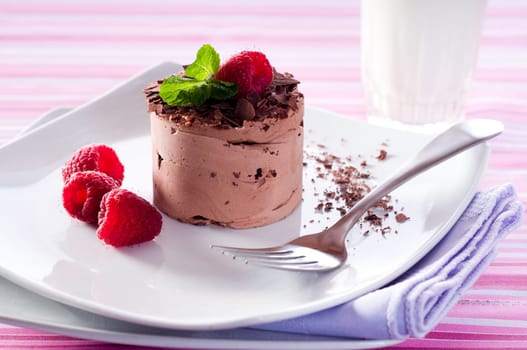 Chocolate Moose dessert on a white plate with milk