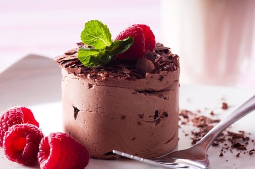 Chocolate Moose dessert on a white plate with milk