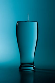 glass of pure water in a blue tone