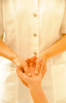 Beautiful woman in a spa with massage therapy