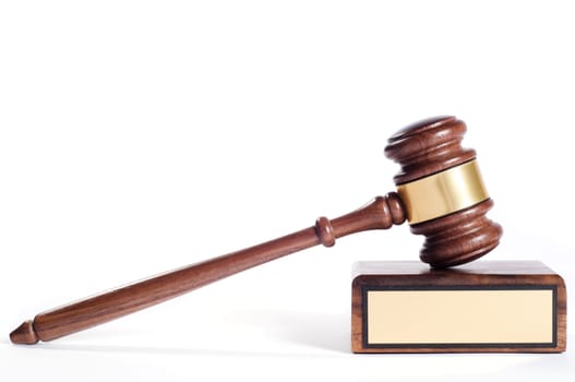 Wooden justice gavel and block with brass