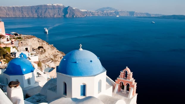 Greek church in santorini greece with a cross