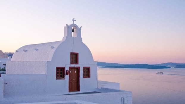 Greek church in santorini greece with a cross