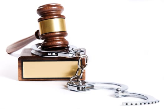 Wooden justice gavel and block with brass