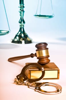 Wooden justice gavel and block with brass