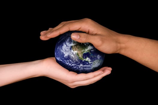 two hands holding a planet earth on black