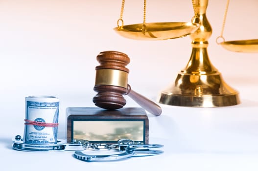 Wooden justice gavel and block with brass