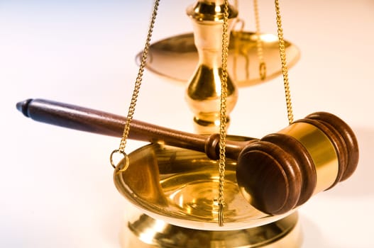 Wooden justice gavel and block with brass