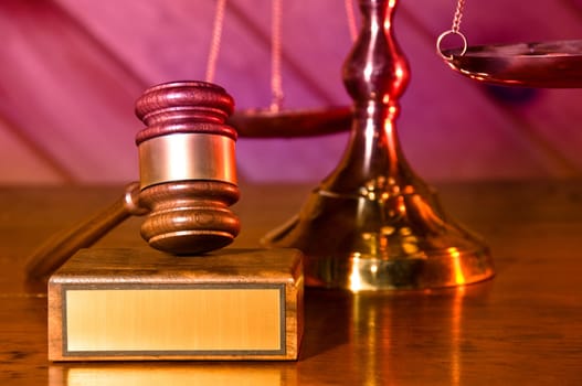 Wooden justice gavel and block with brass