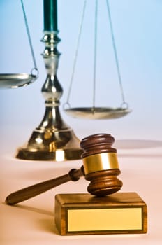 Wooden justice gavel and block with brass