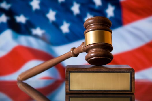 Wooden justice gavel and block with brass