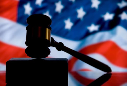 Wooden justice gavel and block with brass